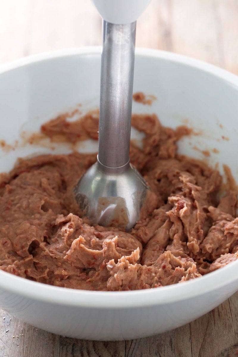 Fat Free Vegan Refried Beans.- You need to give this refried beans recipe a try. It's a healthier, vegan, fat-free version, but it's super tasty and so easy to make.