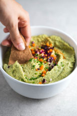 Vegan pesto hummus - This vegan pesto hummus is a delicious appetizer or spread. It's a super healthy and simple recipe and is really easy to make.