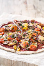 Simple Vegan Gluten Free Pizza.- This delicious pizza is homemade, vegan, gluten-free, low in fat and so easy to make. Feel free to add your favorite veggies and ingredients.