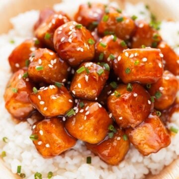 Photo of a bowl of general tso's tofu served over some rice