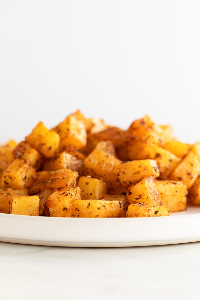 Side shot of a plate of homemade breakfast potatoes