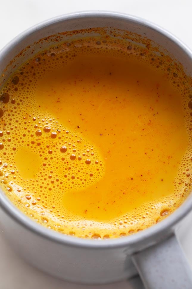 Close-up shot of a mug with golden milk