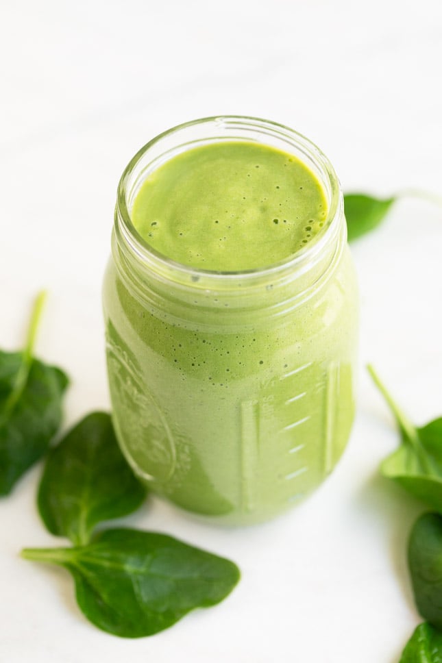 A picture of a jar with avocado smoothie made from scratch
