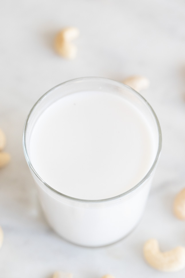 An overhead shot of a glass with homemade cashew milk