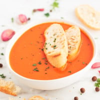Square photo of a bowl of vegan tomato soup