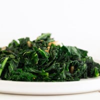 Square photo of a plate of sauteed kale