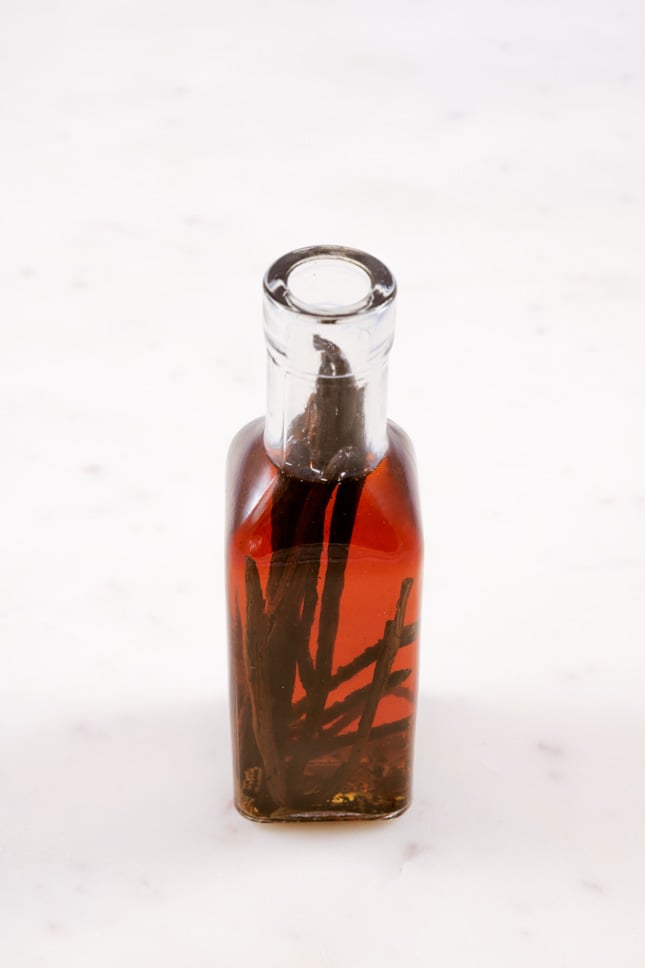 A picture of a glass bottle with homemade vanilla extract 