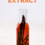 A slide shot of a bottle with homemade vanilla extract and the words vanilla extract