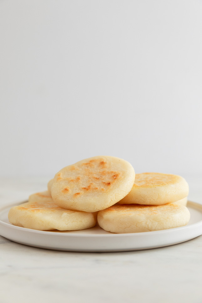 Side shot of arepas on a plate