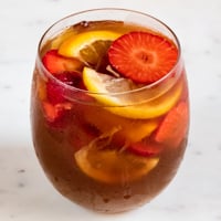 A square picture of a glass with homemade white sangria