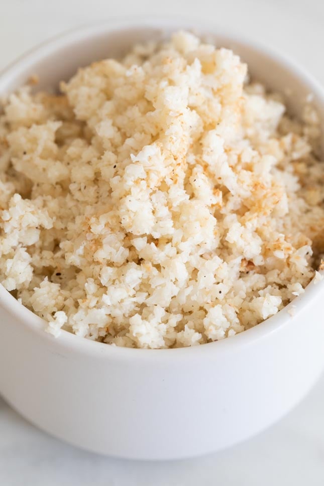A close up shot of a bowl with cauliflower rice from scratch