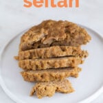 A frontal shot of a homemade seitan in a plate