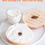 A picture of a dish with a bowl with vegan cream cheese and a sliced bagel