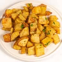 Square photo of a plate of roasted potatoes