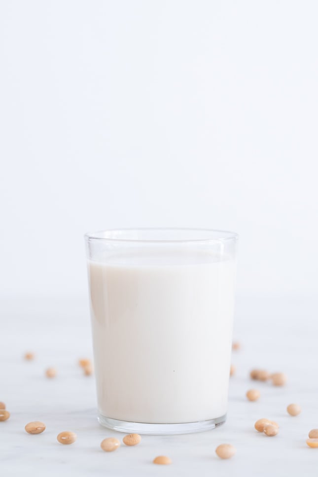 Side shot of a glass with homemade soy milk