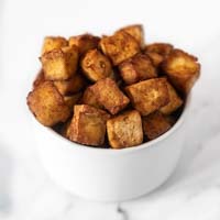 Square photo of a bowl of air fryer tofu