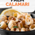 Side shot of a bowl of hearts of palm calamari with the words hearts of palm calamari