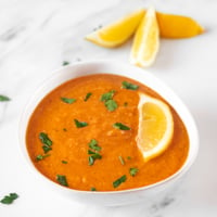 Square photo of a bowl of red lentil soup