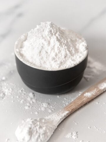 Photo of a bowl and a spoonful of homemade powdered sugar