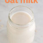 A picture of a jar with oat milk with the words how to make oat milk