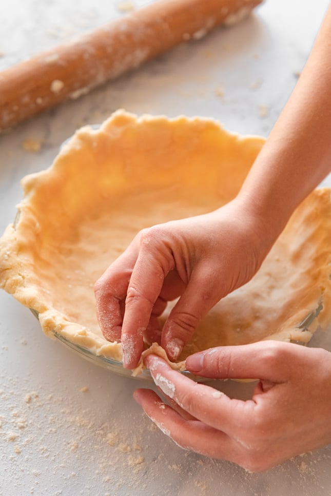 Photo of one of the steps of how to make vegan pie crust