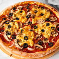 Square photo of a vegan pizza