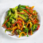 A square picture of a dish with veggie stir fry made from scratch