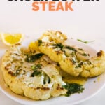 A photo of a dish with 2 cauliflower steaks with chimichurri sauce and the words cauliflower steak
