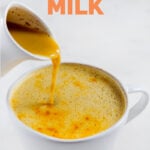 Photo of a pitcher pouring golden milk into a mug