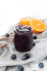 Photo of a little glass jar of blueberry compote