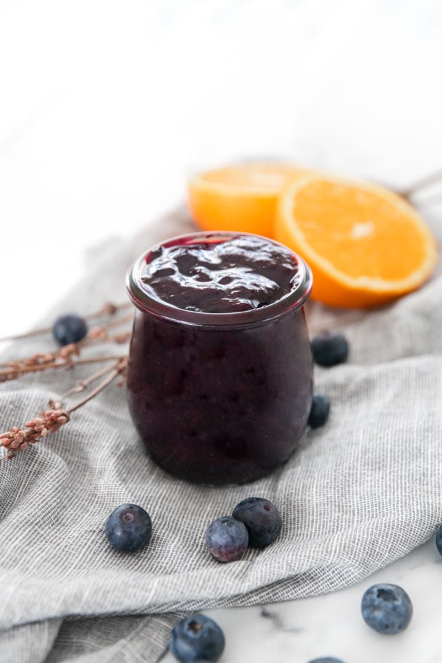 Photo of a little glass jar of blueberry compote
