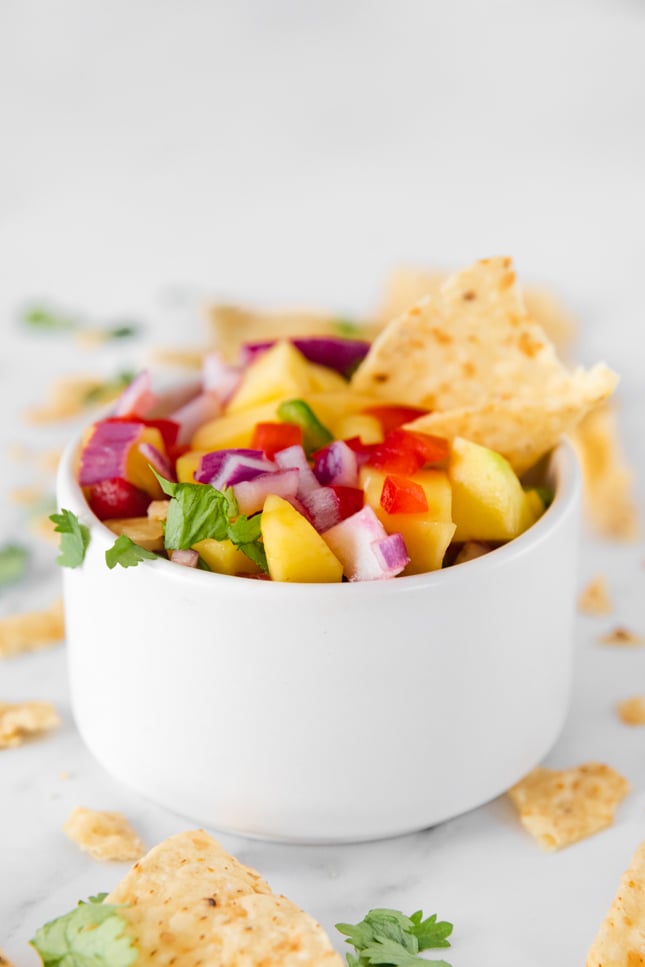 Side photo of a bowl of mango salsa