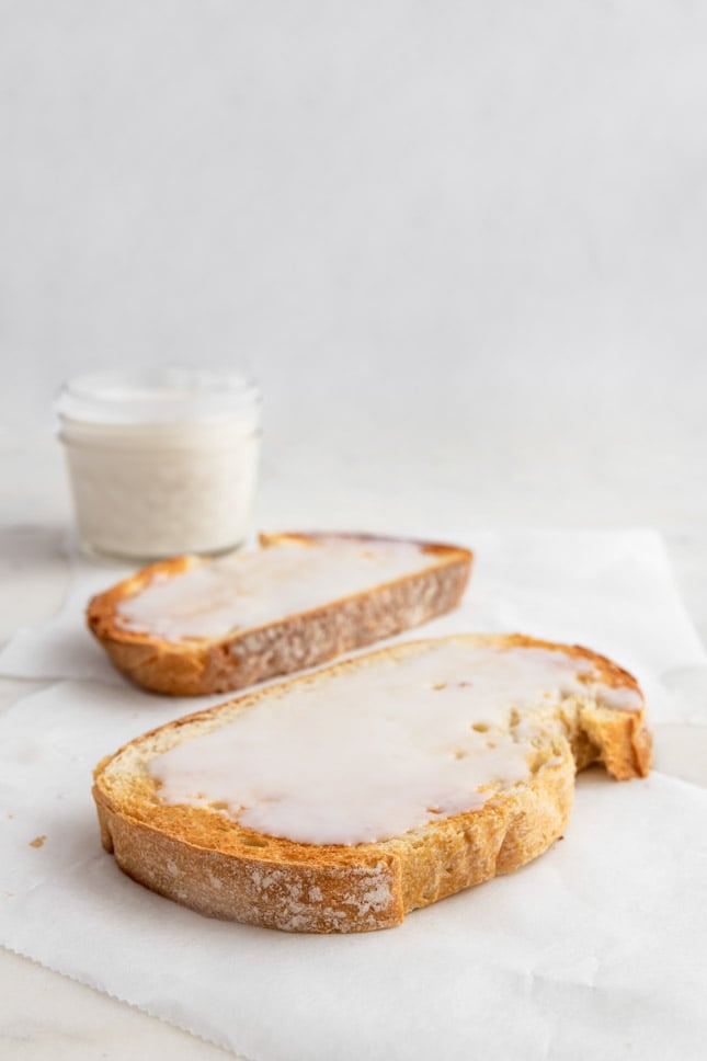 Photo of 2 toasts with some coconut butter spread on them
