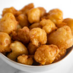 Square photo of a bowl of fried cauliflower