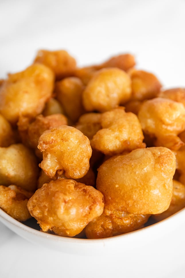 Close-up photo of a bowl of fried cauliflower