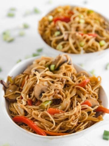 Photo of two bowls of vegetable chow mein