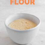 Photo of a bowl of homemade coconut flour with the words coconut flour