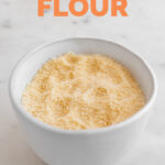 Photo of a bowl of coconut flour with the words coconut flour