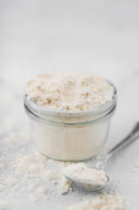 Photo of a small glass jar of gluten-free flour blend