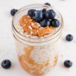 Square photo of a glass jar of overnight oats
