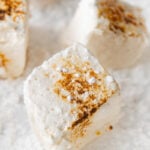 Photo of some toasted vegan marshmallows with the words vegan marshmallows