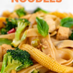 Close-up photo of a bowl of drunken noodles with the words drunken noodles