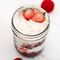 Square photo of a glass jar of coconut yogurt