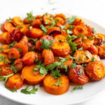 Square photo of a plate of roasted carrots