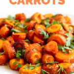 Side shot of a plate of roasted carrots with the words roasted carrots