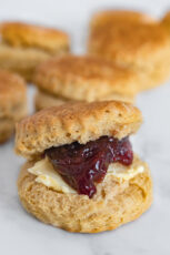 Photo of some vegan biscuits with berry compote and vegan butter
