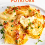 Photo of a plate of vegan scalloped potatoes with the words vegan scalloped potatoes