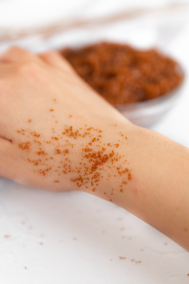 Photo of some sugar scrub while being used on the skin