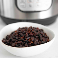 Square photo of a bowl of Instant Pot black beans