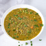 Square photo of a bowl of vegan split pea soup